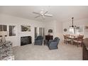 Bright living room with fireplace, seating area, and dining space at 15050 N Thompson Peak Pkwy # 1010, Scottsdale, AZ 85260