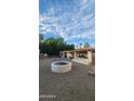 Large backyard with a fire pit and covered patio area at 15829 N 12Th St, Phoenix, AZ 85022