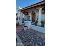 Front entry with columns, tile flooring, and a wooden door at 15829 N 12Th St, Phoenix, AZ 85022