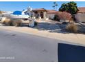 Front view of house, boat parked in driveway, desert landscaping at 15829 N 12Th St, Phoenix, AZ 85022