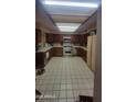 Spacious kitchen with wood cabinets and tile flooring at 15829 N 12Th St, Phoenix, AZ 85022