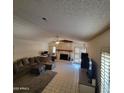 Bright living room with a fireplace and tile floors at 15829 N 12Th St, Phoenix, AZ 85022