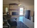 Spacious living room featuring a fireplace and tile floors at 15829 N 12Th St, Phoenix, AZ 85022