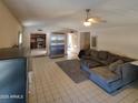 Living room with a view into the kitchen and stainless steel refrigerator at 15829 N 12Th St, Phoenix, AZ 85022