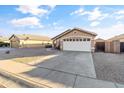 Front view of a single-story house with a garage at 15913 W Elm St, Surprise, AZ 85374