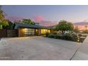 Attractive curb appeal with modern garage and landscaping at 1837 E Minnezona Ave, Phoenix, AZ 85016