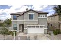 Two-story house with attached garage and landscaping at 1908 E Hawken Pl, Chandler, AZ 85286