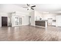 Open concept living room with tile floors and kitchen at 2047 E Devon Rd, Gilbert, AZ 85296