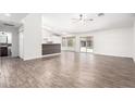 Bright living room with tile floors and a kitchen bar at 2047 E Devon Rd, Gilbert, AZ 85296