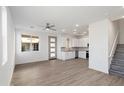 Bright and spacious living area with wood-look floors at 2125 E Voltaire Ave, Phoenix, AZ 85022