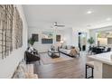 Spacious living room featuring hardwood floors and ample natural light at 2126 E Voltaire Ave, Phoenix, AZ 85022