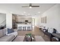 Bright and airy living room with an open floor plan and kitchen view at 2126 E Voltaire Ave, Phoenix, AZ 85022