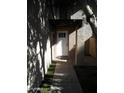 Front entrance with white door and covered walkway at 2208 W Lindner Ave # 17, Mesa, AZ 85202