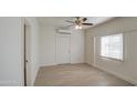 Light and airy bedroom with wood floors and a ceiling fan at 232 S San Carlos St, Florence, AZ 85132