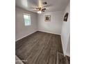 Bright bedroom with wood-look flooring and ceiling fan at 2523 N 28Th St, Phoenix, AZ 85008