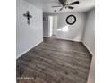 Second bedroom with wood-look flooring and ceiling fan at 2523 N 28Th St, Phoenix, AZ 85008