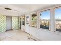 Sunroom with floral wallpaper and backyard access at 26207 S Lime Dr, Queen Creek, AZ 85142