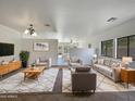 Bright and airy living room with ample seating and large windows at 3057 E Superior Rd, San Tan Valley, AZ 85143