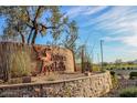 Sonoran Foothills community entrance sign with stonework and landscaping at 32029 N 19Th Ln, Phoenix, AZ 85085