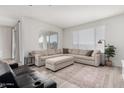 Spacious living room featuring light flooring and large windows at 32040 N Lisadre Ln, San Tan Valley, AZ 85144