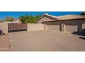 Two-car garage with large concrete driveway at 3464 N Ashbrook St, Mesa, AZ 85213