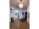 Spacious entryway, featuring tile flooring and a blue door at 35801 N Zachary Rd, San Tan Valley, AZ 85144