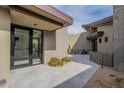 Modern home featuring a private courtyard with tiled flooring, and desert landscaping at 39493 N 107Th Way, Scottsdale, AZ 85262