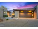 Stunning desert home boasts modern architecture, a three-car garage and xeriscaped yard at 39493 N 107Th Way, Scottsdale, AZ 85262