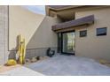 Stunning modern front entrance with desert landscaping and a tiled patio at 39493 N 107Th Way, Scottsdale, AZ 85262