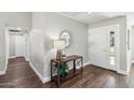 Bright entryway with hardwood floors, a console table, and a mirror at 4726 E Grandview Rd, Phoenix, AZ 85032