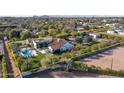 Aerial shot outlining an estate with pool, putting green, and meticulously landscaped grounds at 5203 N Monte Vista Dr, Paradise Valley, AZ 85253