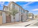 Modern two-story home with a landscaped yard and driveway at 755 E Zion Dr # 103, Gilbert, AZ 85297