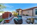 Relaxing patio with fireplace and seating area, perfect for outdoor living at 7575 E Camino Salida Del Sol --, Scottsdale, AZ 85266