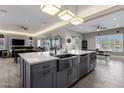 Spacious kitchen island with farmhouse sink and modern lighting at 8308 W Avenida Del Sol --, Peoria, AZ 85383