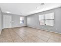 Bright living room with tile floors and neutral walls at 8851 E Pampa Ave, Mesa, AZ 85212