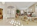 Bright living room with fireplace and large windows at 9509 E Arrowvale Dr, Sun Lakes, AZ 85248