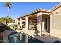 Relaxing backyard oasis with a pool and covered patio at 9509 E Arrowvale Dr, Sun Lakes, AZ 85248