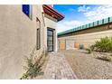 Modern home with brick pathway, drought-resistant landscaping, and a side gate at 1 Easy St # 12, Carefree, AZ 85377