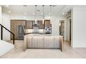 Modern kitchen with stainless steel appliances and light wood cabinetry at 1 Easy St # 12, Carefree, AZ 85377