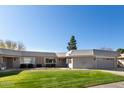 Front view of a single-story house with a grassy yard at 10161 W Pineaire Dr, Sun City, AZ 85351