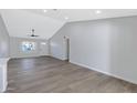 Open and airy living room with hardwood floors and vaulted ceiling at 1104 N Oak Ct, Gilbert, AZ 85233