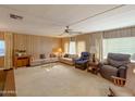 Spacious living room with ample seating and large windows at 120 N Val Vista Dr # 81, Mesa, AZ 85213