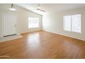 Living room with hardwood floors and plenty of natural light at 12750 W Dreyfus Dr, El Mirage, AZ 85335