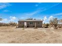 Single story home with desert landscaping and spacious yard at 13705 S 209Th Ave, Buckeye, AZ 85326