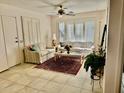 Bright living room with tiled floors and comfy seating at 14300 W Bell Rd # 5, Surprise, AZ 85374