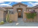 Elegant entryway with a custom wood door and security system at 2223 W Hazelhurst Ct, Anthem, AZ 85086