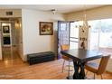 Small dining area with a table and chairs near the entryway at 2300 W Temple St, Chandler, AZ 85224