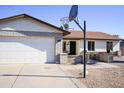 House exterior with a two-car garage and basketball hoop at 2300 W Temple St, Chandler, AZ 85224