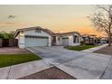 Two-story house with white exterior, landscaped lawn, and a two-car garage at 255 W Seagull Pl, Chandler, AZ 85286