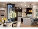 Modern kitchen with stainless steel appliances and wine storage at 25838 N 104Th Pl, Scottsdale, AZ 85255